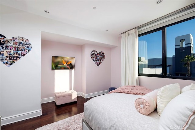 bedroom featuring dark hardwood / wood-style flooring