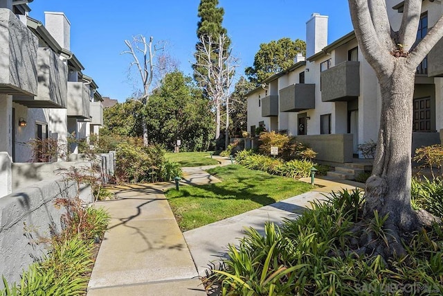 surrounding community featuring a yard