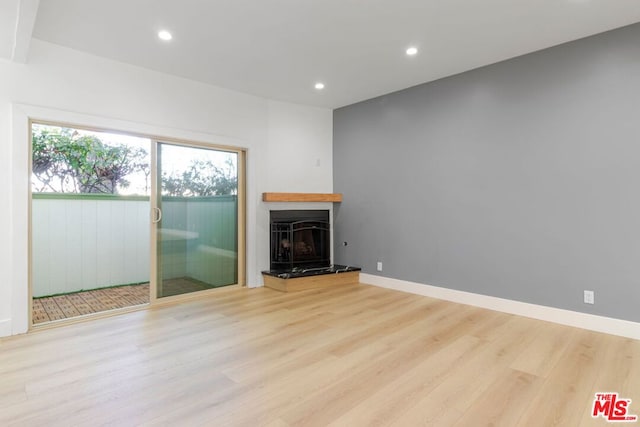 unfurnished living room featuring light hardwood / wood-style flooring