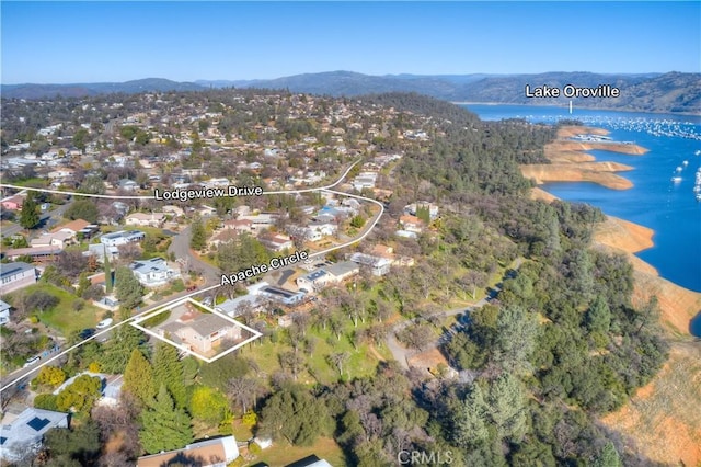 drone / aerial view with a water and mountain view