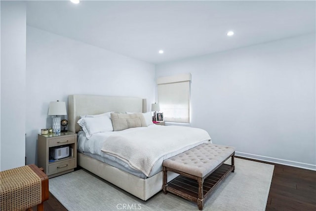 bedroom with hardwood / wood-style flooring