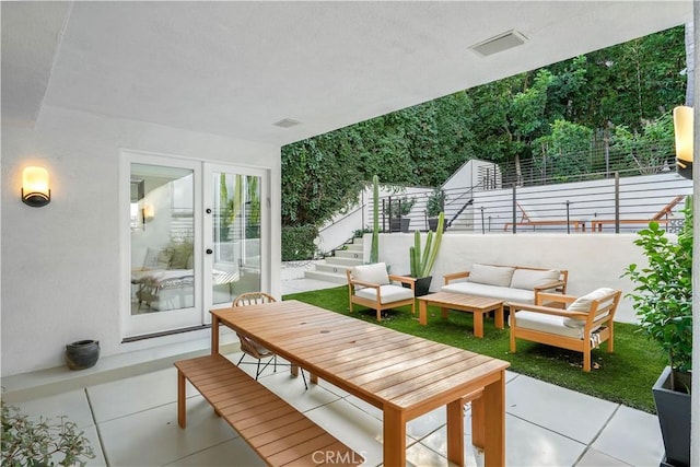 view of patio / terrace featuring outdoor lounge area and french doors