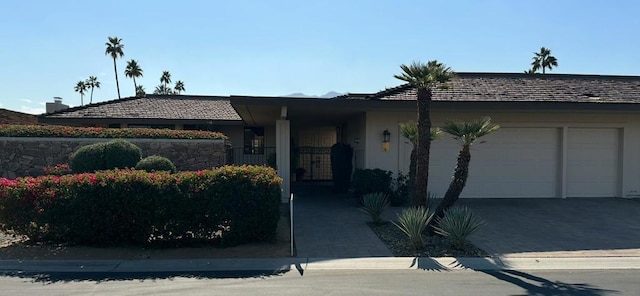 ranch-style home featuring a garage