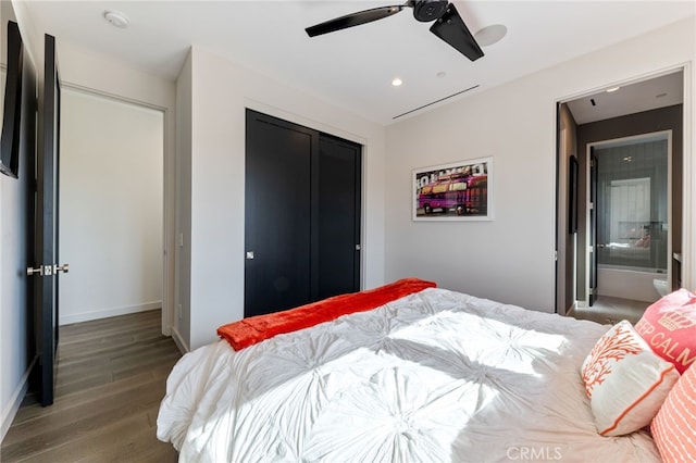 bedroom with hardwood / wood-style floors, a closet, and ceiling fan