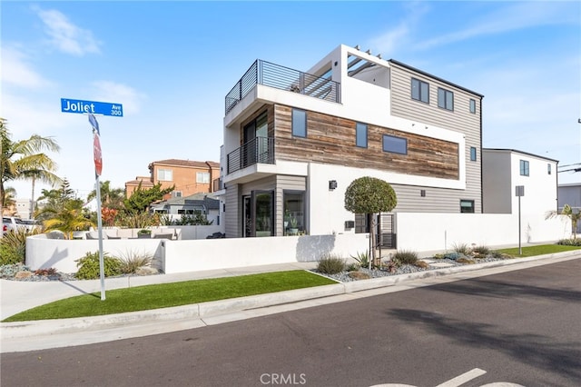 view of front of property with a balcony