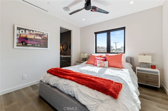 bedroom with dark hardwood / wood-style flooring, connected bathroom, and ceiling fan