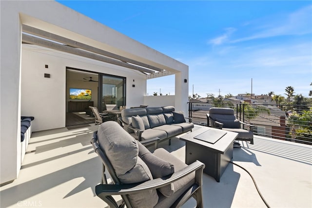 view of patio / terrace with an outdoor living space and a balcony