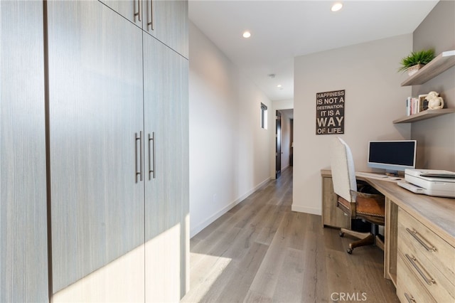 office with light hardwood / wood-style flooring