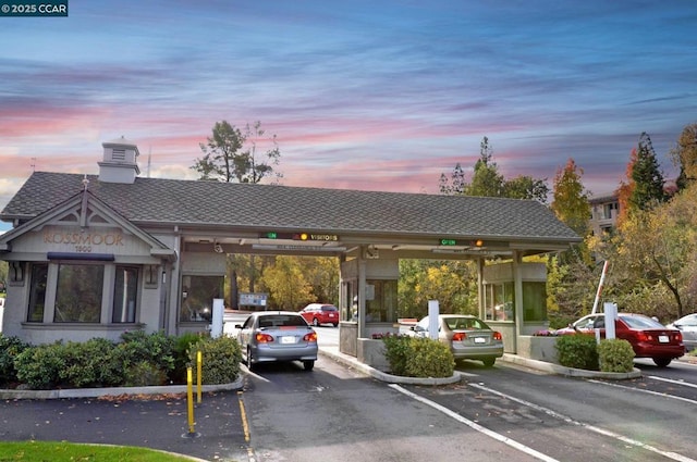 view of parking at dusk