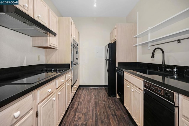 kitchen featuring light brown cabinetry, sink, extractor fan, dark hardwood / wood-style floors, and black appliances