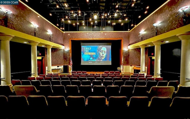 home theater room featuring ornate columns