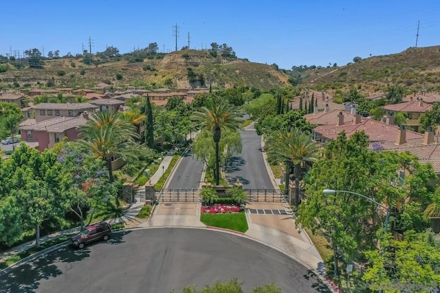 birds eye view of property with a mountain view