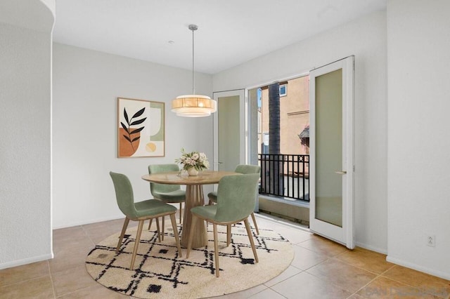 dining room featuring light tile patterned flooring