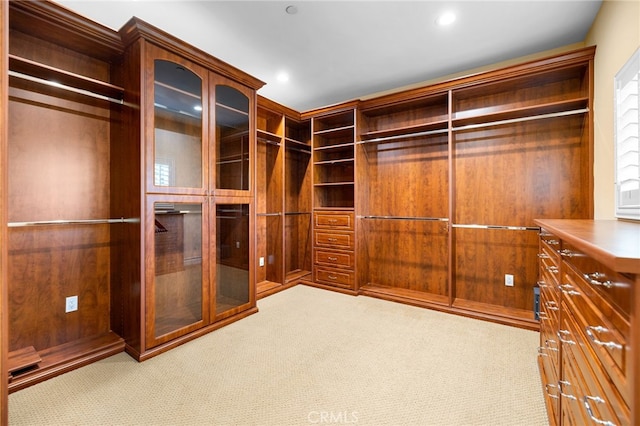 walk in closet featuring carpet