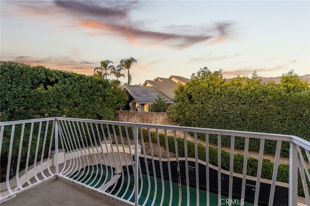 view of balcony at dusk