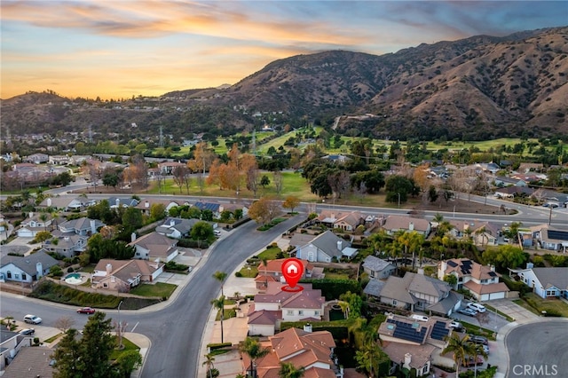 aerial view at dusk with a mountain view