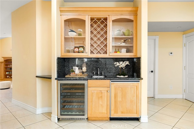 bar with wine cooler, decorative backsplash, dark stone countertops, and light tile patterned flooring