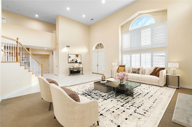 tiled living room with a high ceiling