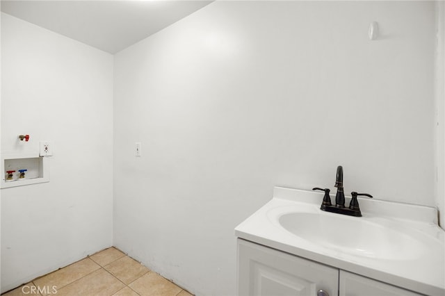 bathroom with tile patterned flooring and vanity