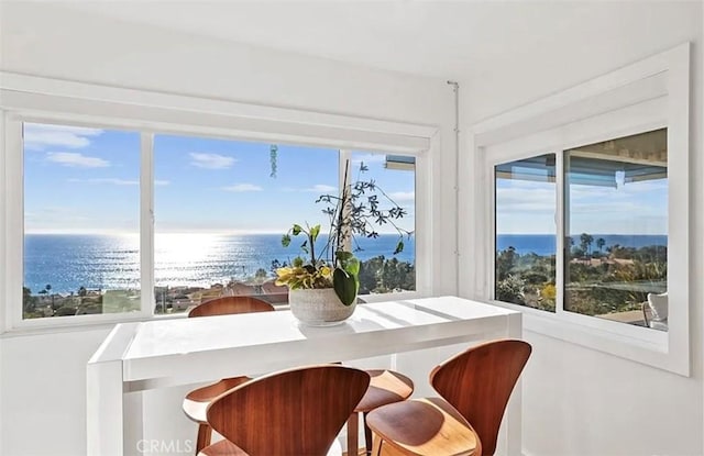 dining area featuring a water view