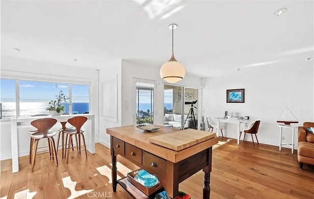 dining area with light wood finished floors