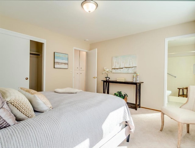 carpeted bedroom featuring connected bathroom