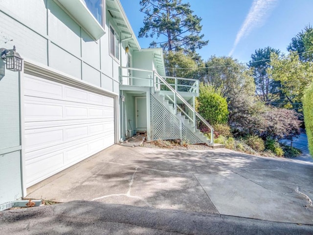 view of side of home with a garage