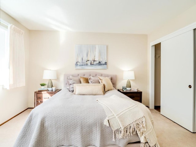 carpeted bedroom with a closet