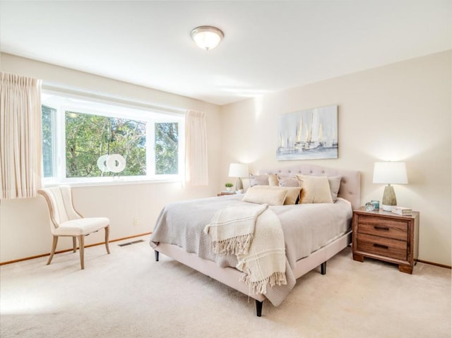 bedroom with light carpet