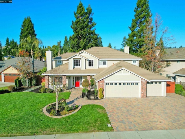 front facade with a garage, covered porch, and a front lawn