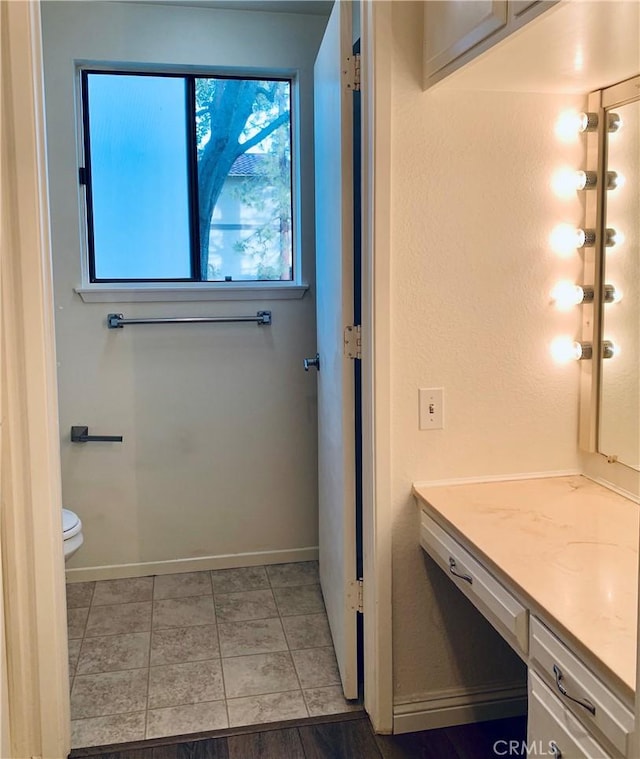 bathroom with vanity and toilet