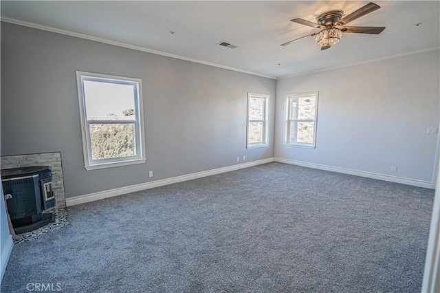 unfurnished living room featuring ornamental molding, ceiling fan, and carpet flooring