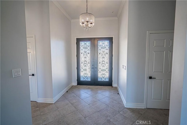 entryway featuring french doors, crown molding, and a notable chandelier