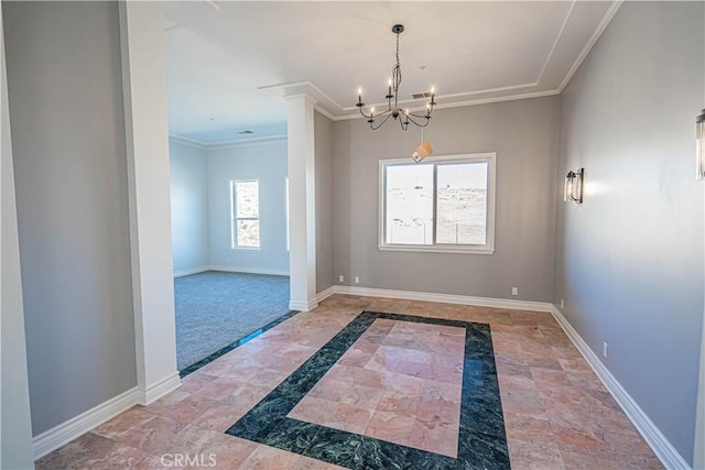 spare room featuring ornamental molding, plenty of natural light, carpet floors, and an inviting chandelier