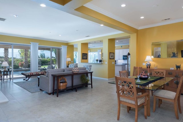 dining space featuring crown molding