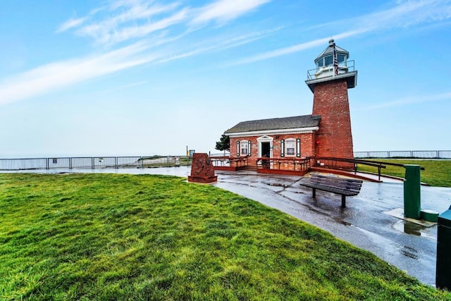 view of yard featuring a deck with water view