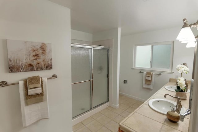 bathroom featuring vanity, tile patterned flooring, and walk in shower