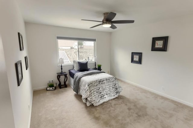 bedroom featuring light carpet and ceiling fan