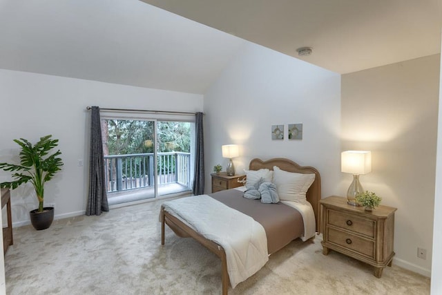 bedroom with lofted ceiling, light colored carpet, and access to exterior