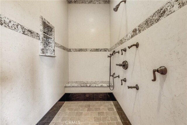 bathroom featuring tile patterned floors and a shower