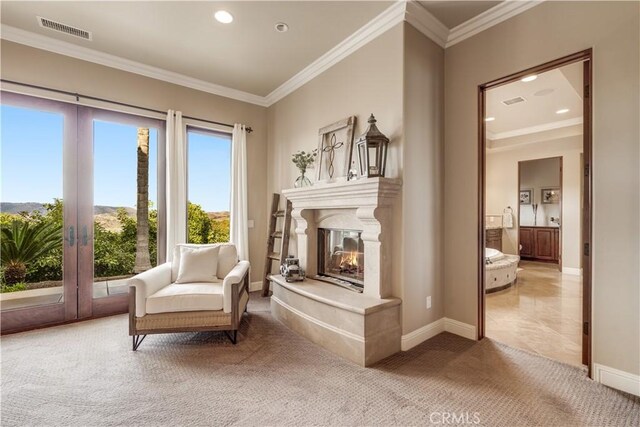 living area with crown molding, light colored carpet, and french doors