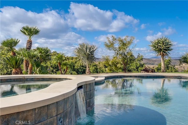 view of pool with a mountain view