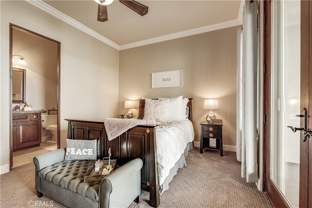 bedroom with crown molding, light carpet, ceiling fan, and ensuite bath