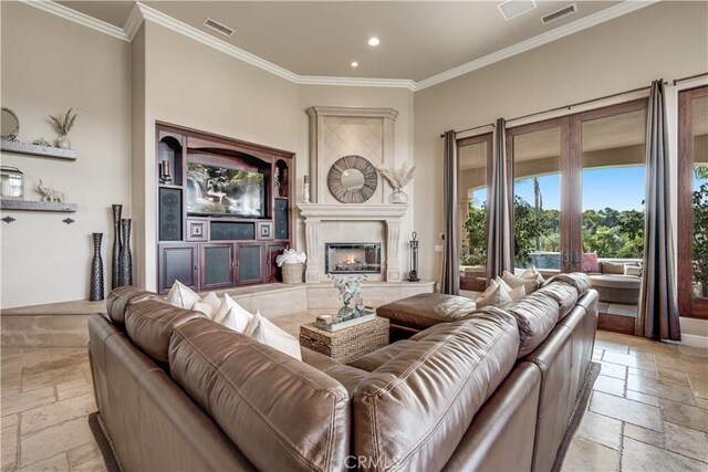 living room with french doors and ornamental molding