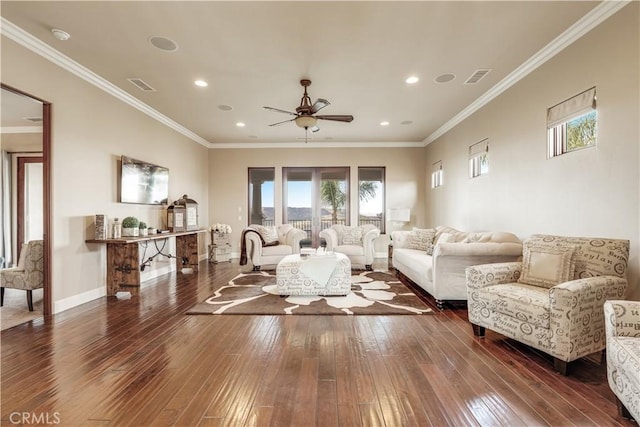 living room with ceiling fan, ornamental molding, and dark hardwood / wood-style flooring