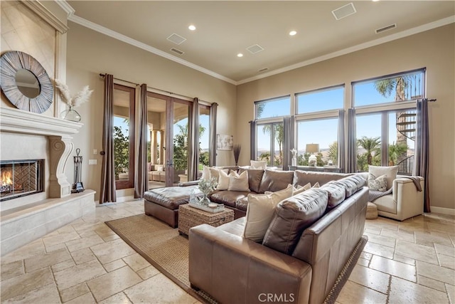 living room featuring crown molding and a fireplace