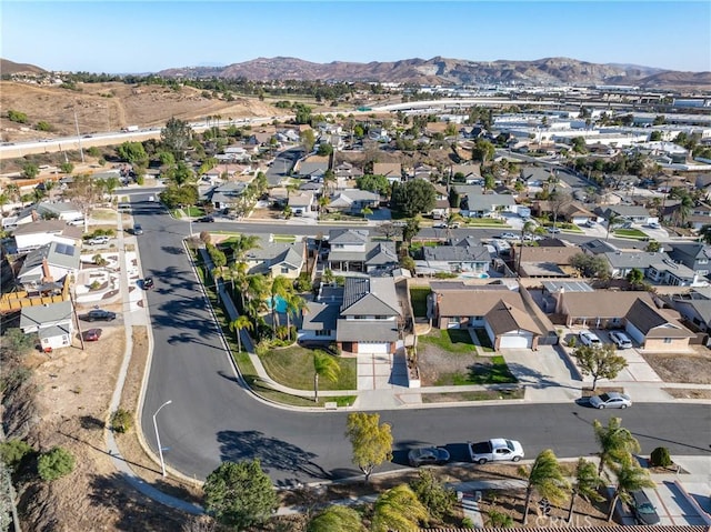 birds eye view of property with a mountain view