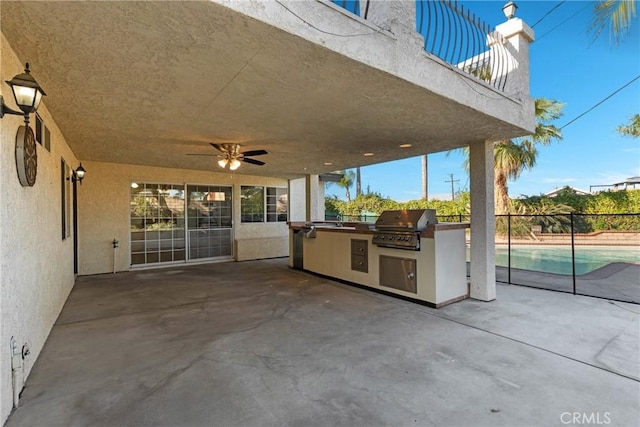 view of patio / terrace with ceiling fan, a balcony, exterior kitchen, and area for grilling