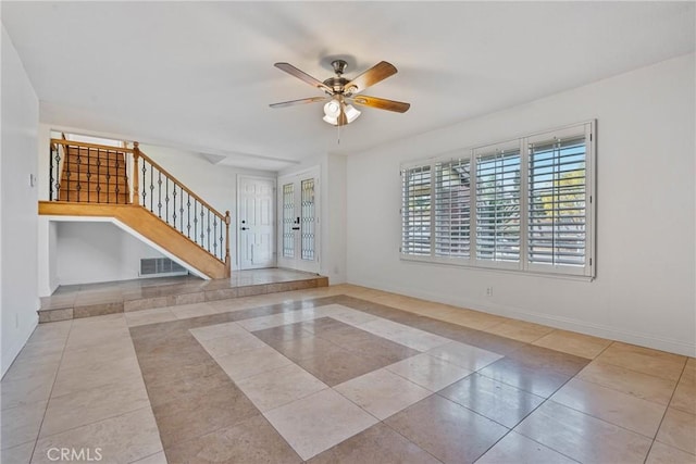 spare room with light tile patterned floors and ceiling fan