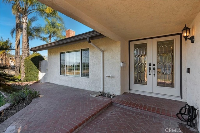 doorway to property featuring french doors and a patio